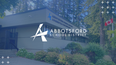 Picture of the School Board Office building with Abbotsford logo overtop