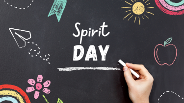 writing on chalk board "spirit day"