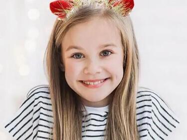 child wearing antlers
