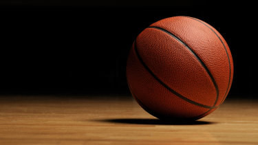 Basketball sitting on gym floor