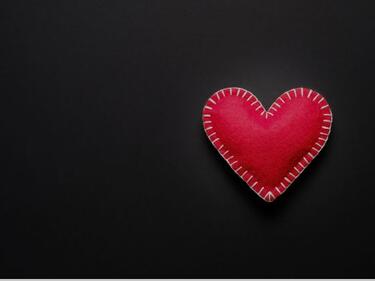 red heart on black background