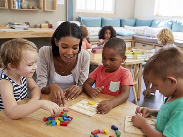 teacher playing with children