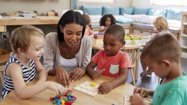 teacher playing with children