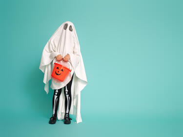 child wear ghost costume