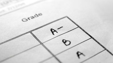 Letter grades on a piece of paper